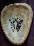 Dangling gold and black hearts